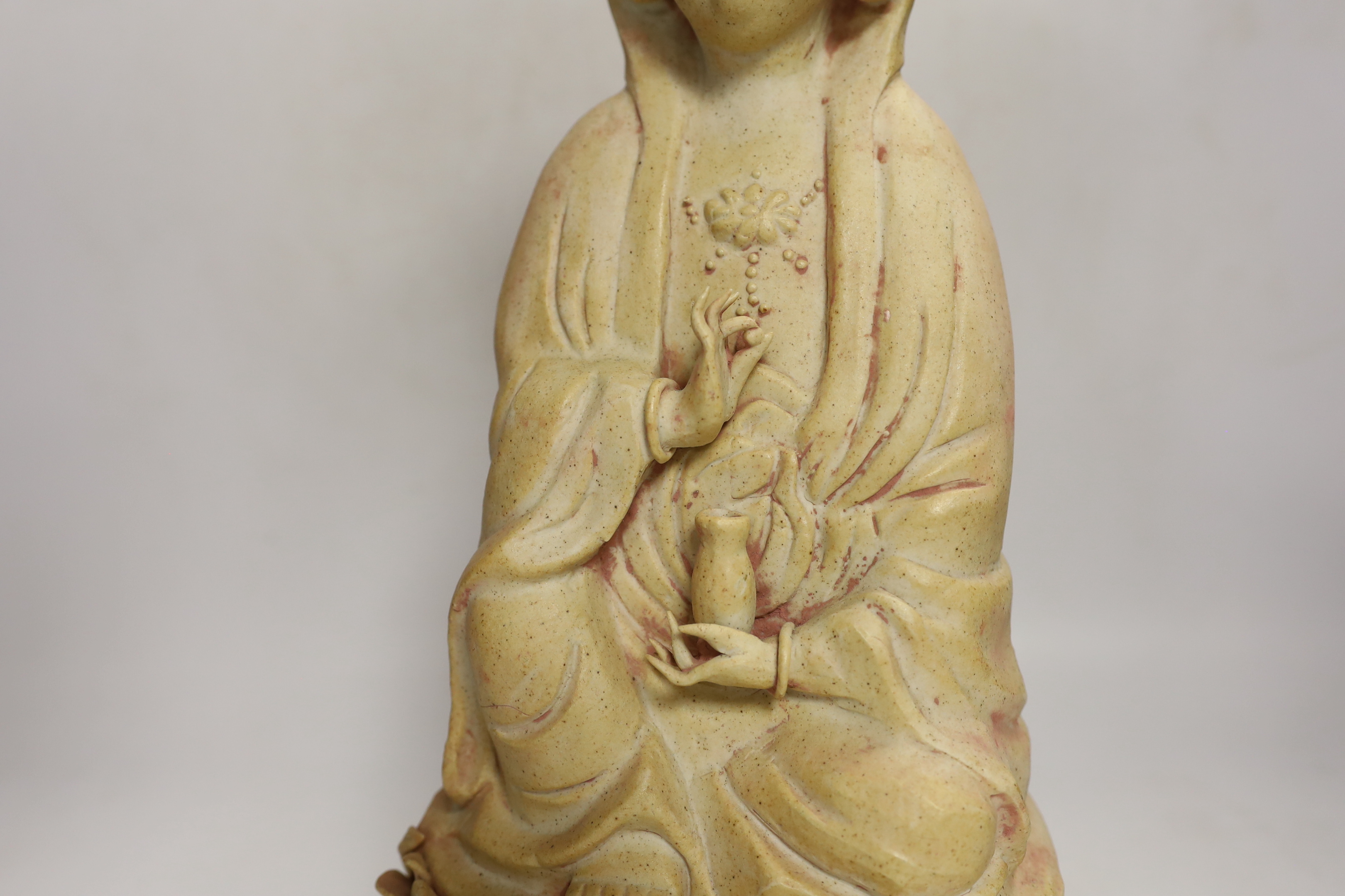 A Chinese biscuit figure of Guanyin, 38cm high